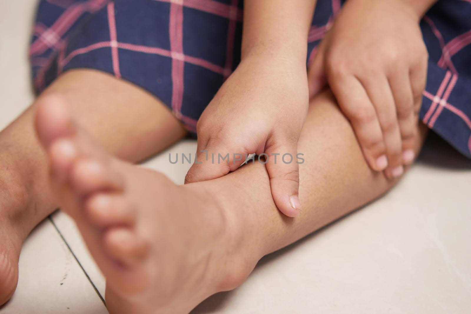 child girl suffering pain on feet ,