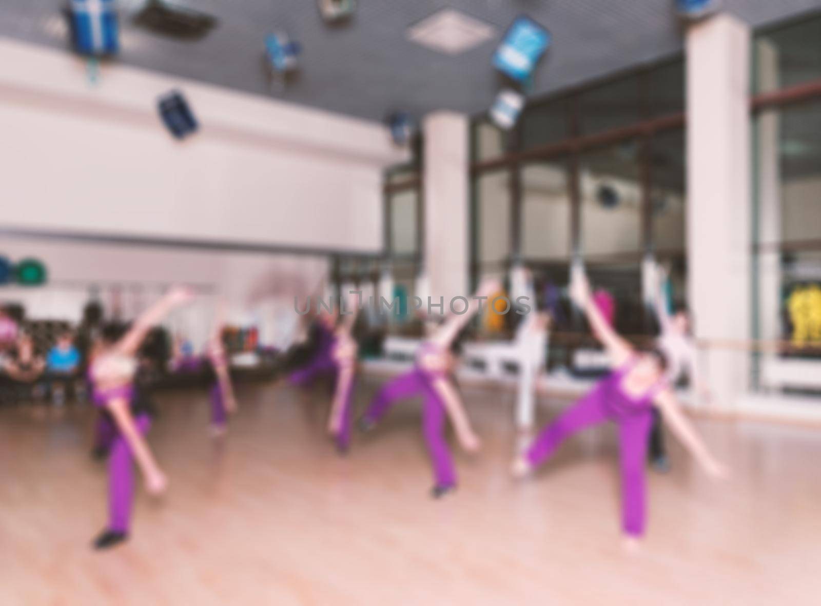 Dance class for women at fitness centre abstract blur background