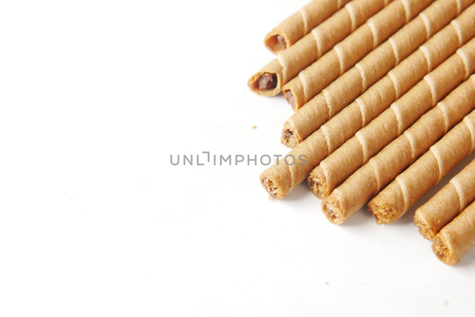 wafer roll chocolate on white background with copy space by towfiq007