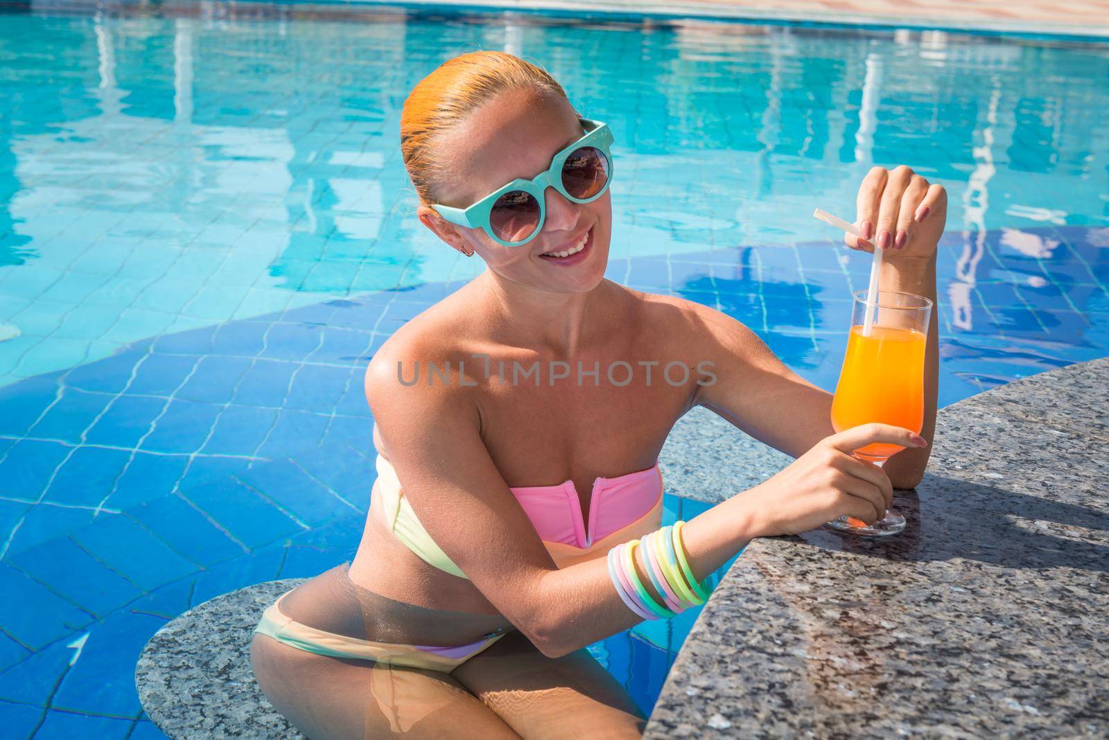 Girl in pool bar by nikitabuida