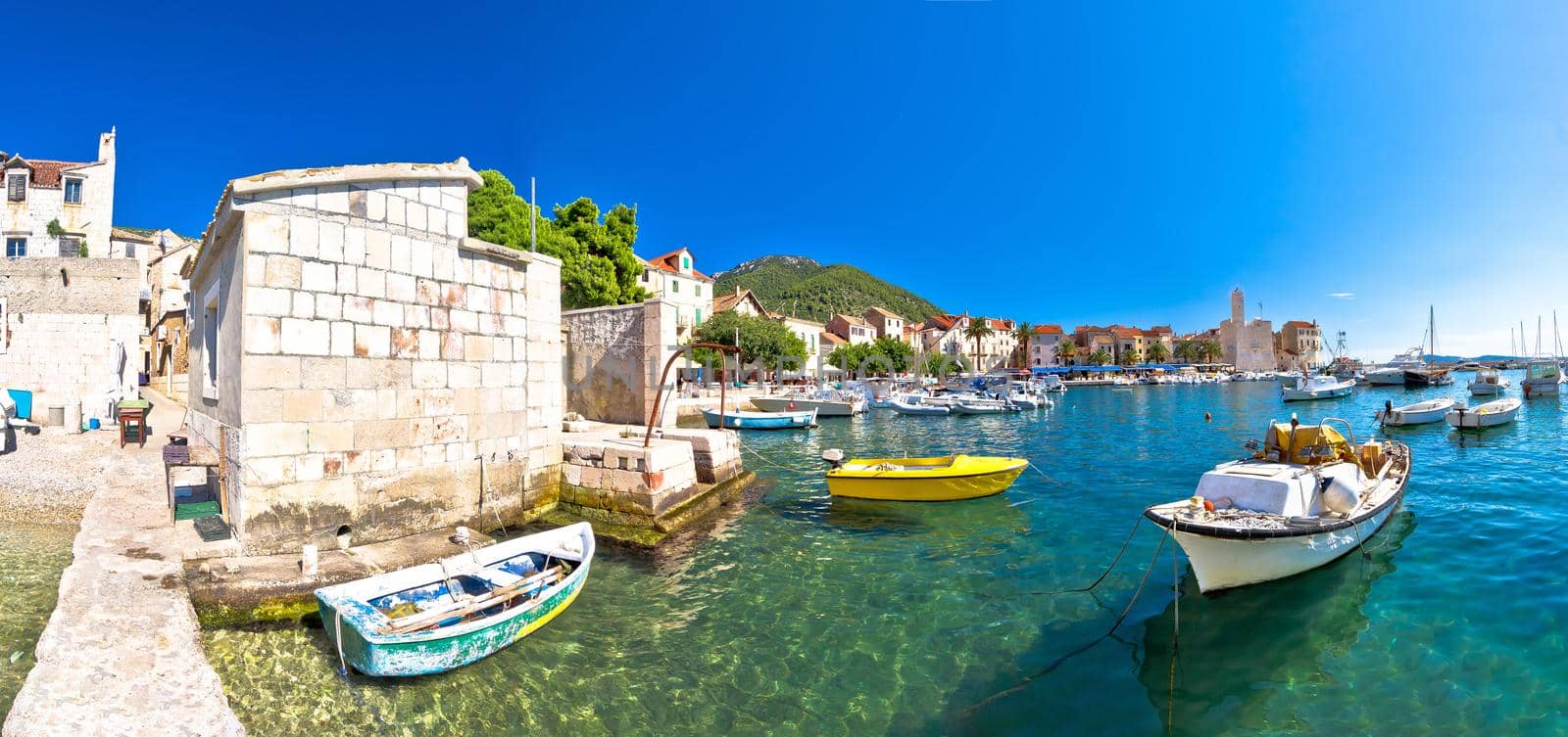 Town of Komiza on Vis island scenic waterfront panoramic view, Dalmatia archipelago of Croatia