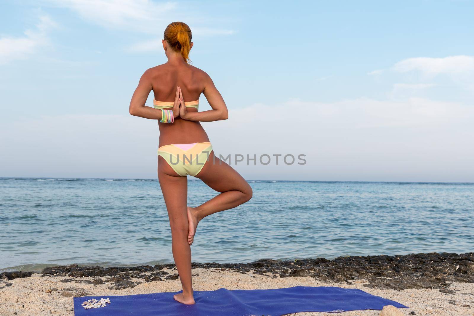 Woman doing yoga by nikitabuida