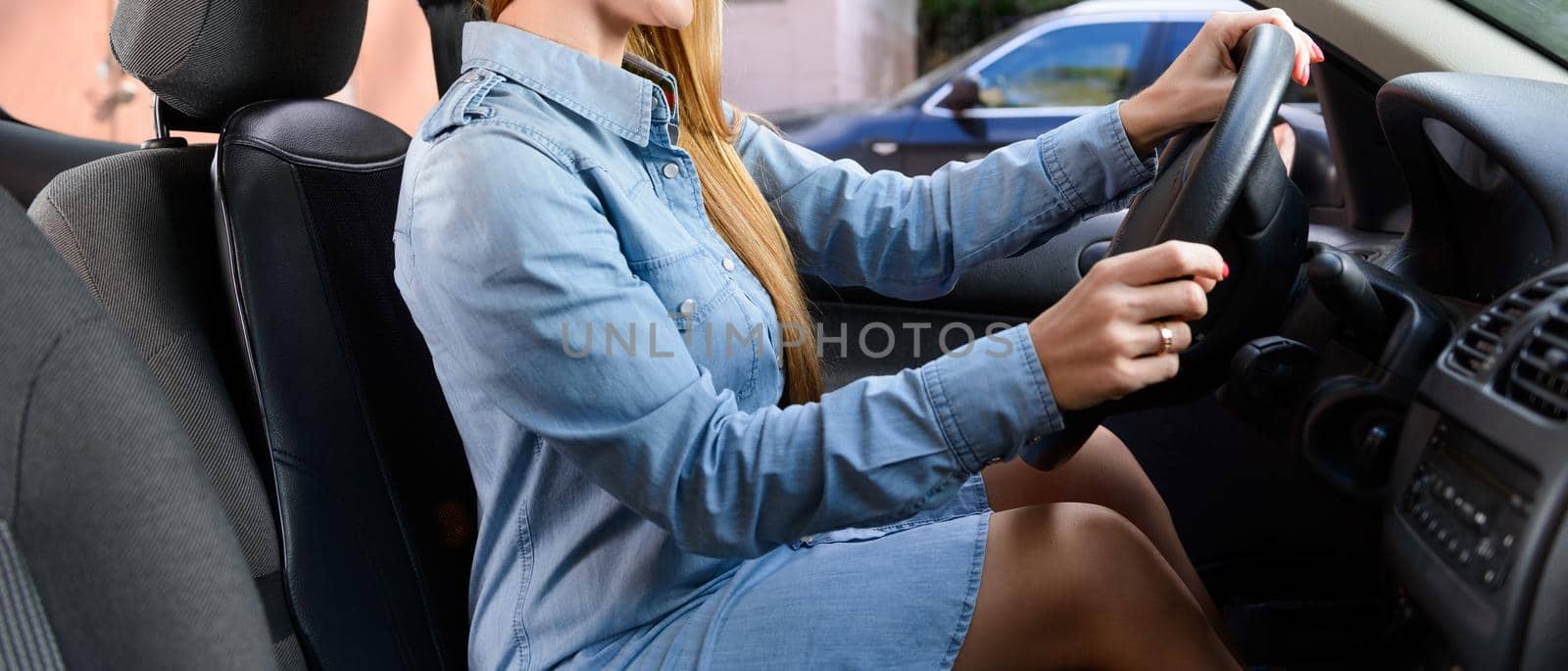 Woman in car with massage seat cushion