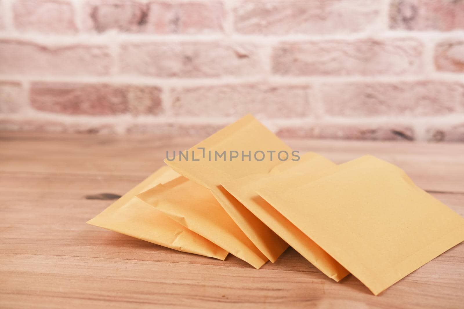 yellow paper bubble envelope on table ,