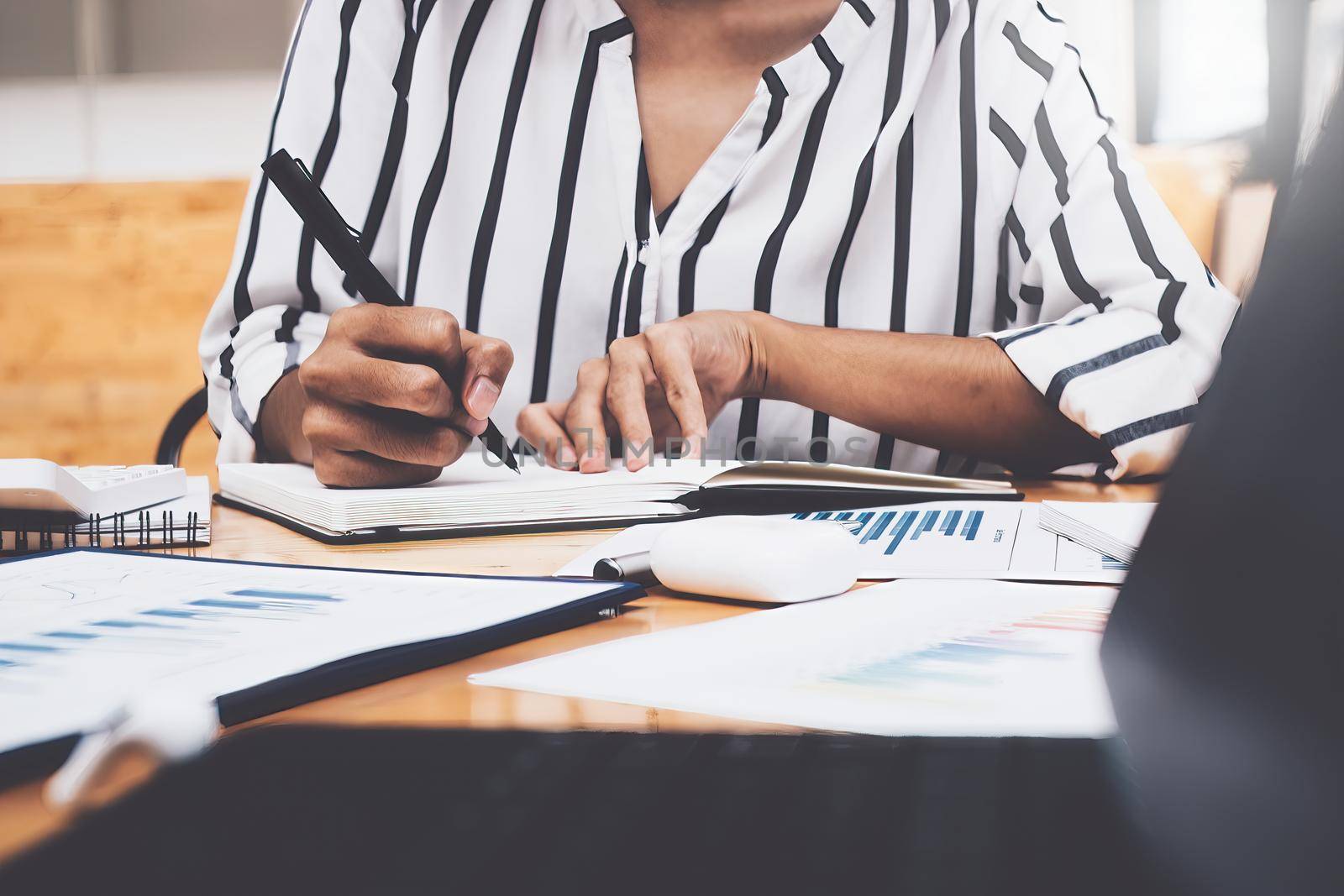 Business woman working to analyze technical price graph and indicator.