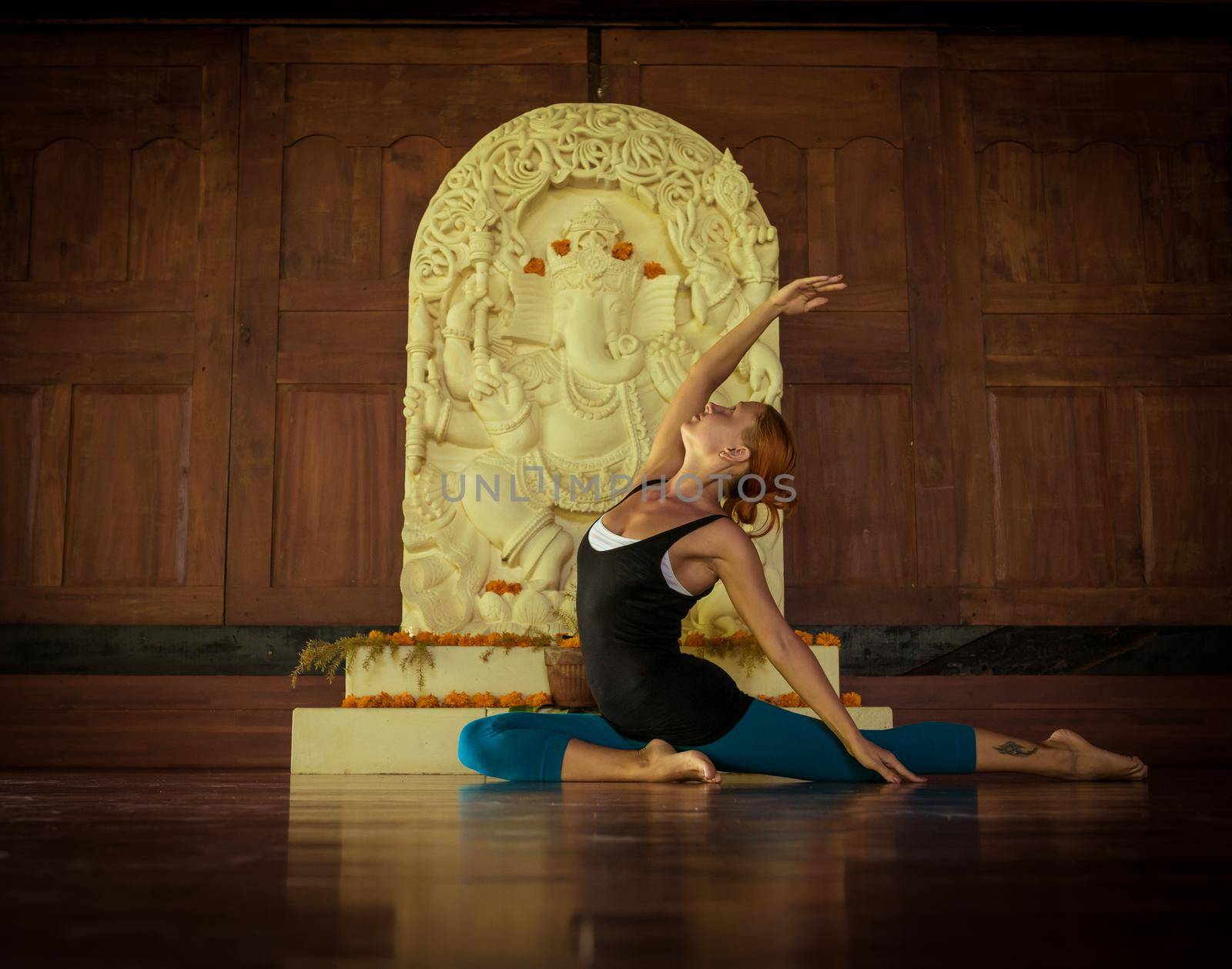 Indoor shot of a young yoga instructor doing asanas