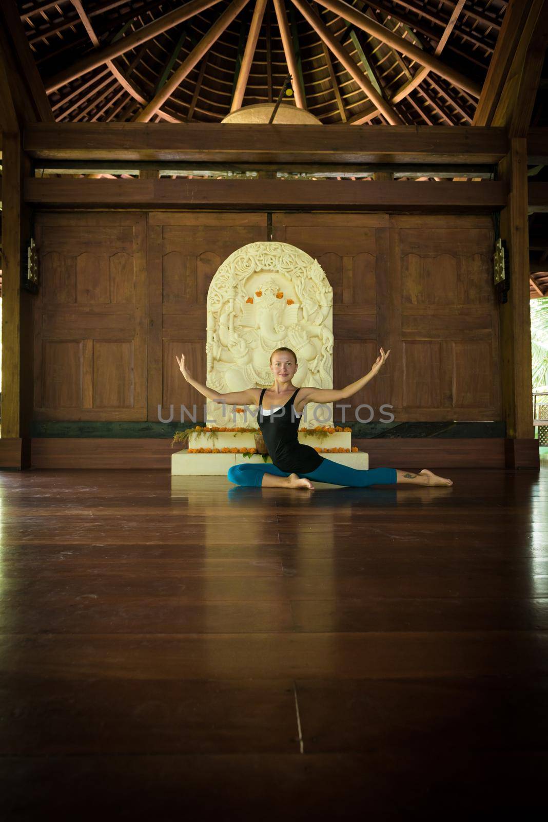 Indoor shot of a young yoga instructor doing asanas