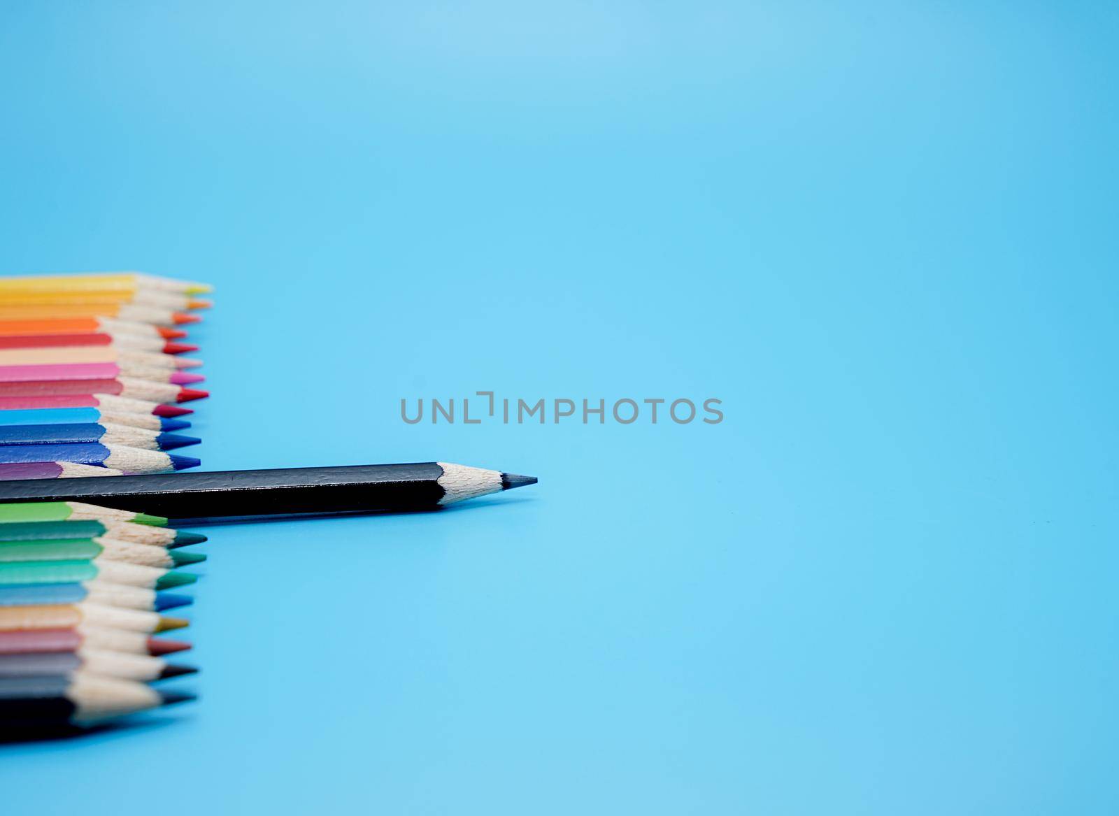 Color pencils on blue background.