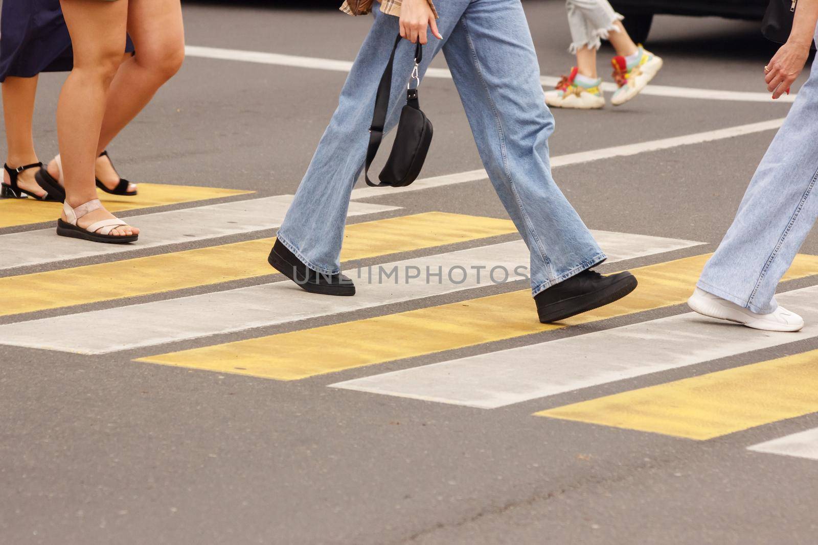 pedestrians walking on a crosswalk by raddnatt