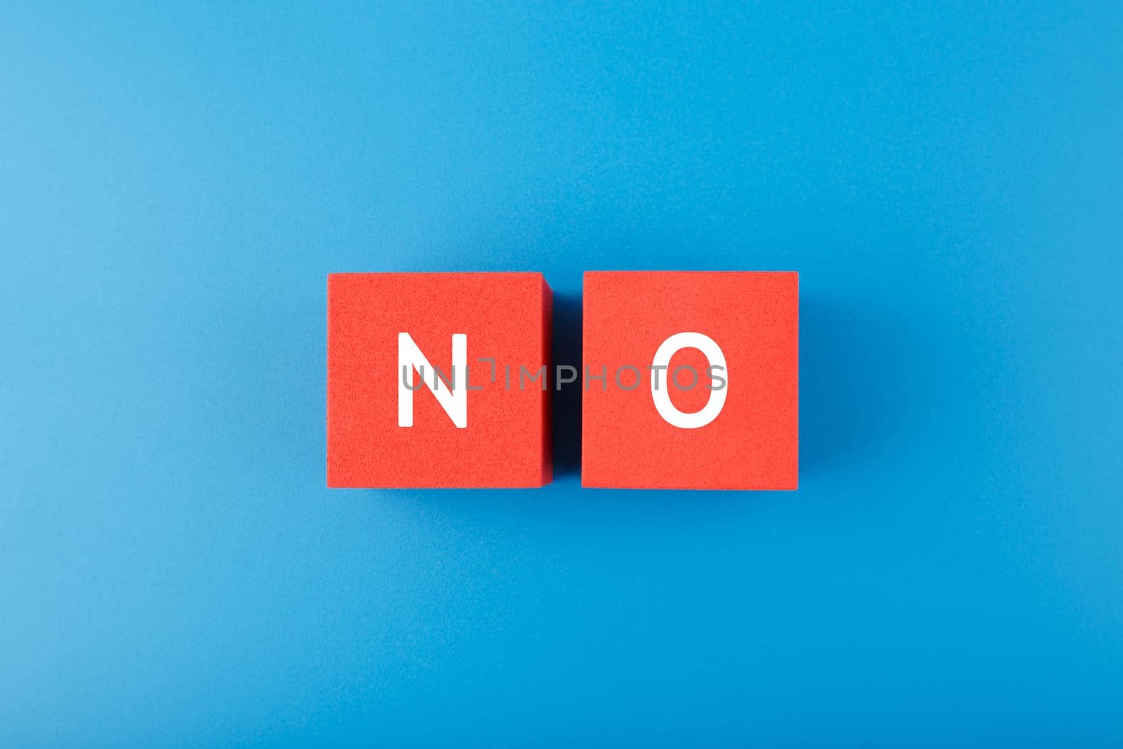 Say no or negative answer minimal concept on blue background by Senorina_Irina