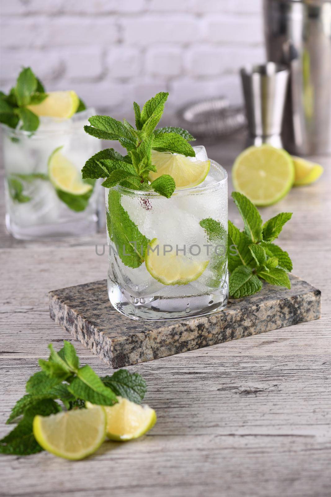 Refreshing summer alcoholic cocktail mojito with ice, fresh mint and lime