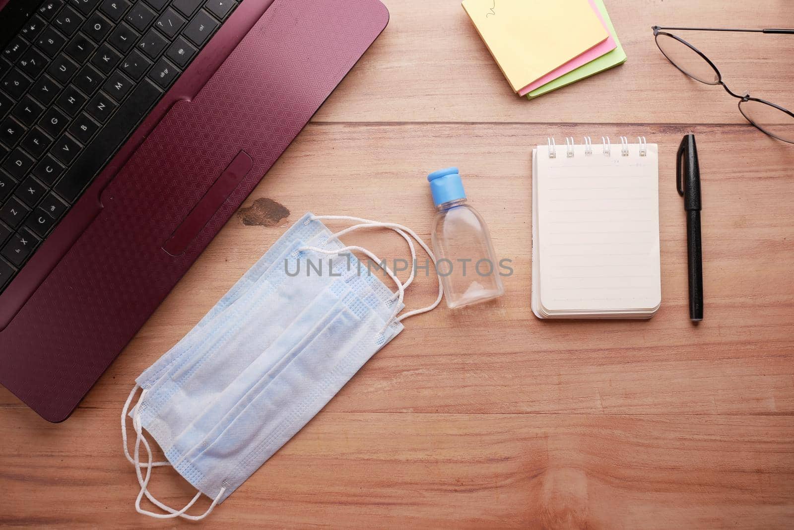 Close up of blue surgical masks on table.