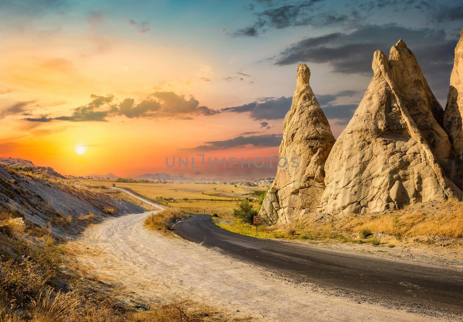 Road in the mountains of Cappadocia at sunset