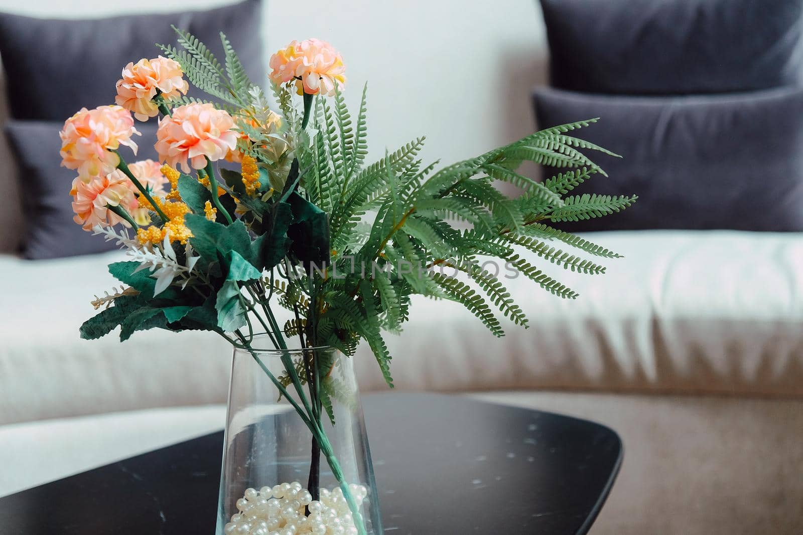 Pink Flower vase on table decoration in living room.