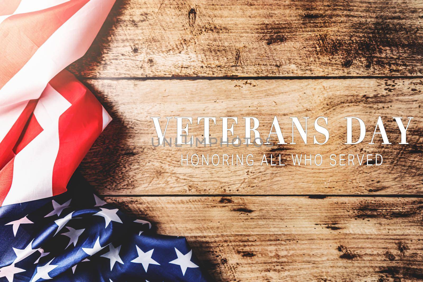 Veterans day. Honoring all who served. American flag on wooden background by psodaz
