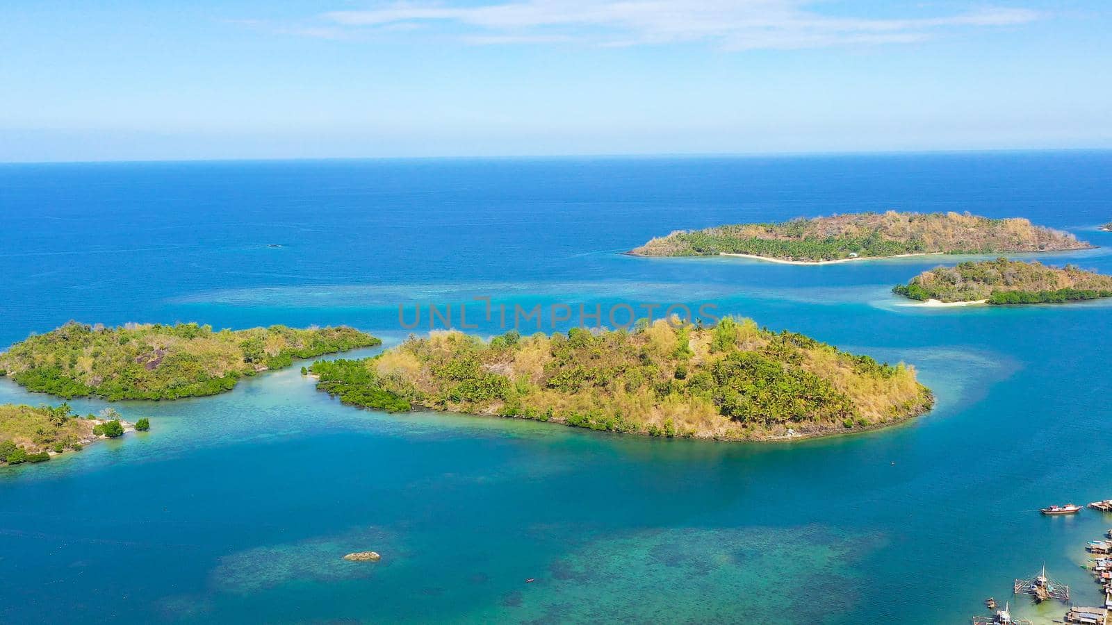 Tropical island with sandy beach on the Zamboanga Peninsula. Sallangan Islands, Simoadang Island. Mindanao, Philippines.