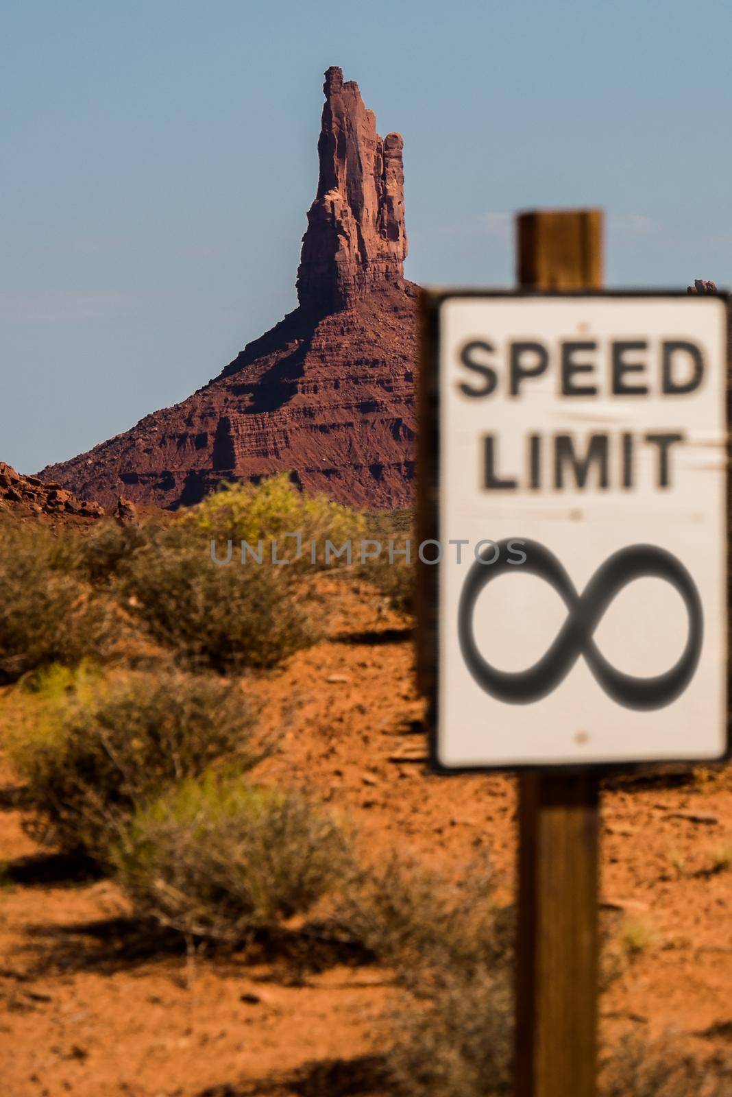 Infinity speed limit sign with mesa in the background by jyurinko