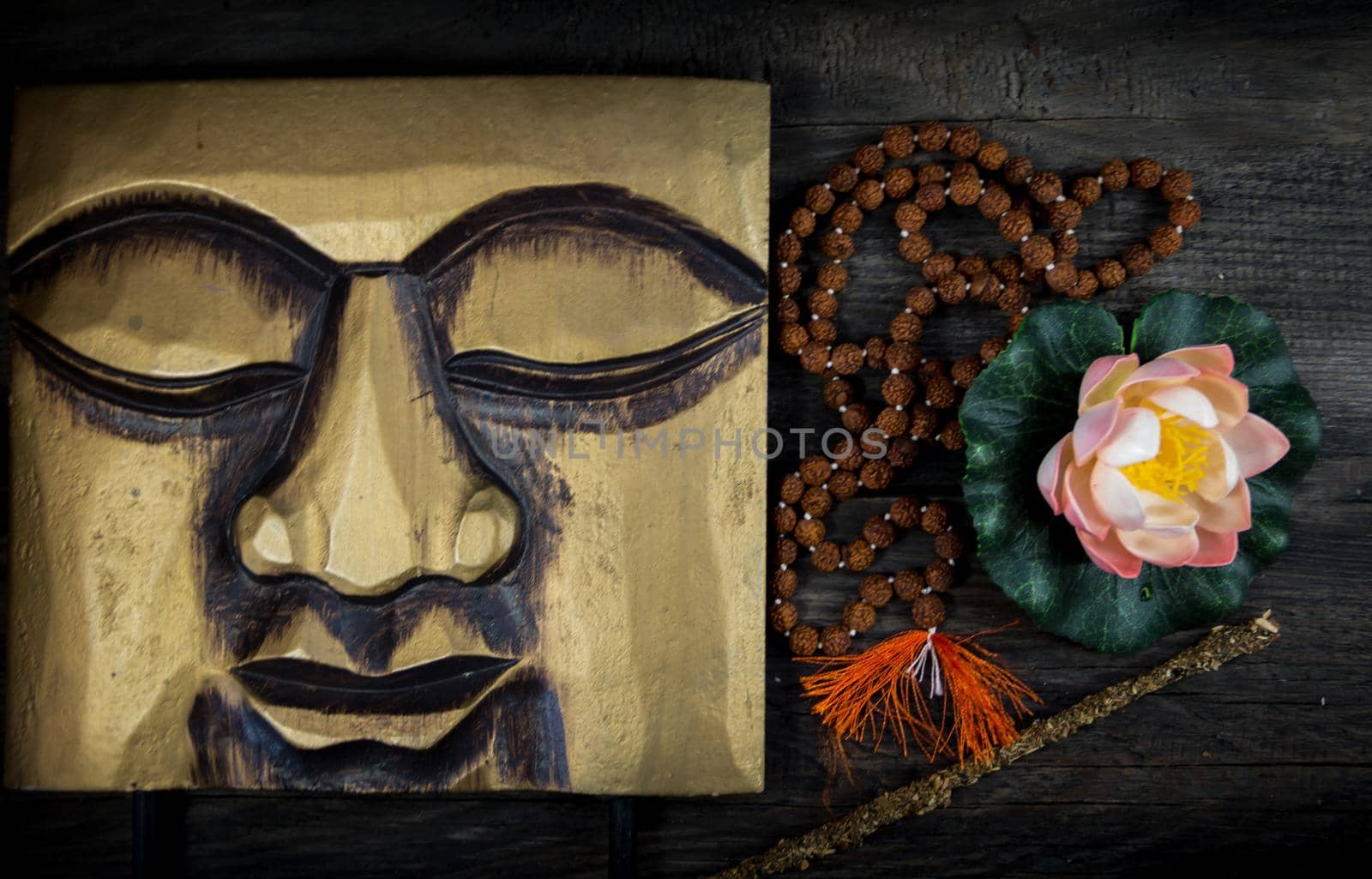 set of buddhist symbols on rustic wooden background