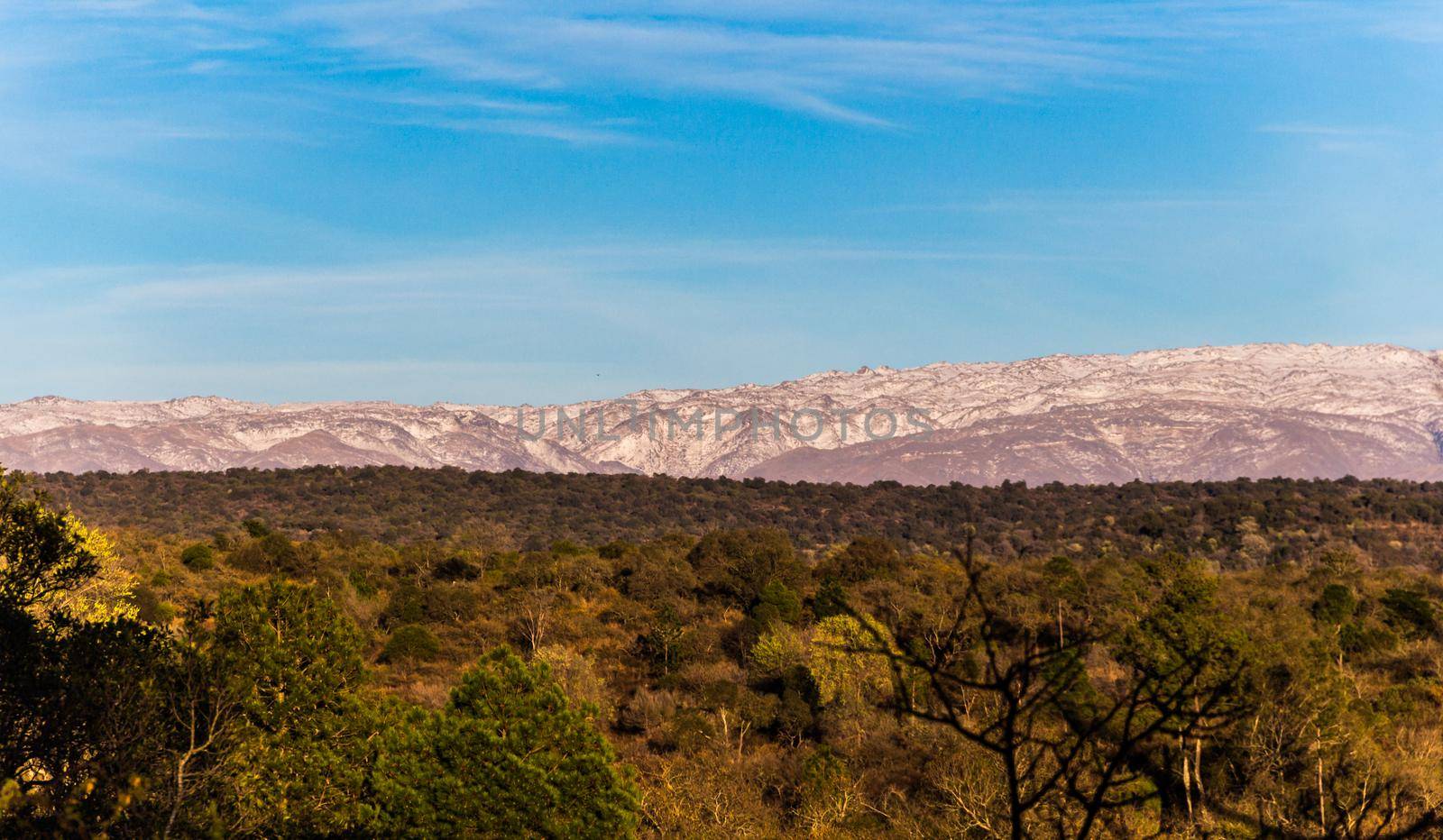 panoramic view of the snowy mountain ranges in the Calamuchita Valley, Cordoba, Argentina by GabrielaBertolini