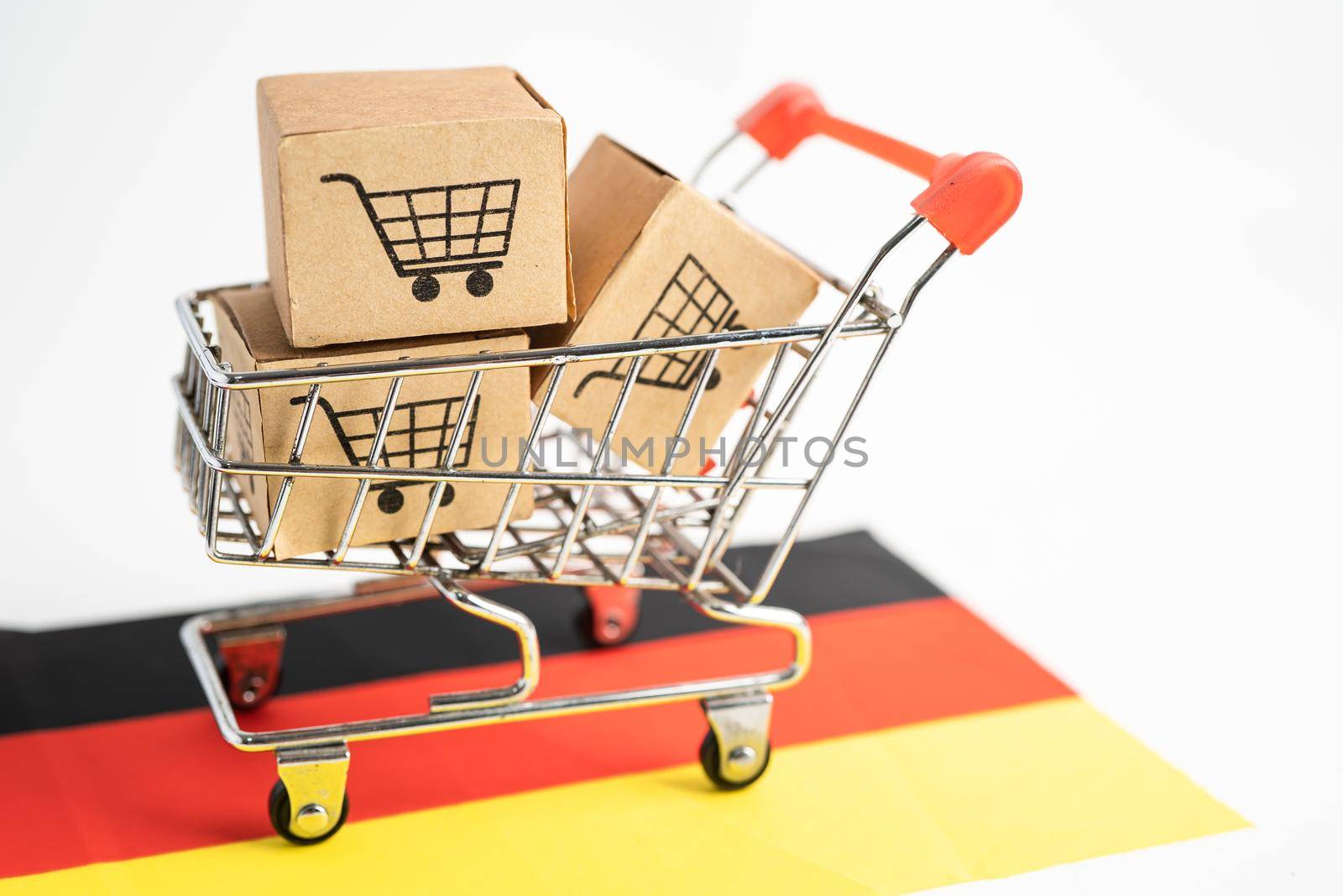 Box with shopping cart logo and Germany flag, Import Export Shopping online or eCommerce finance delivery service store product shipping, trade, supplier concept. by pamai