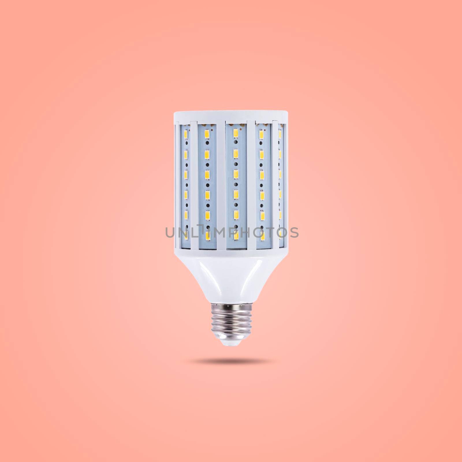 LED energy saving lamp 230v isolated on orange pastel color background by wattanaphob