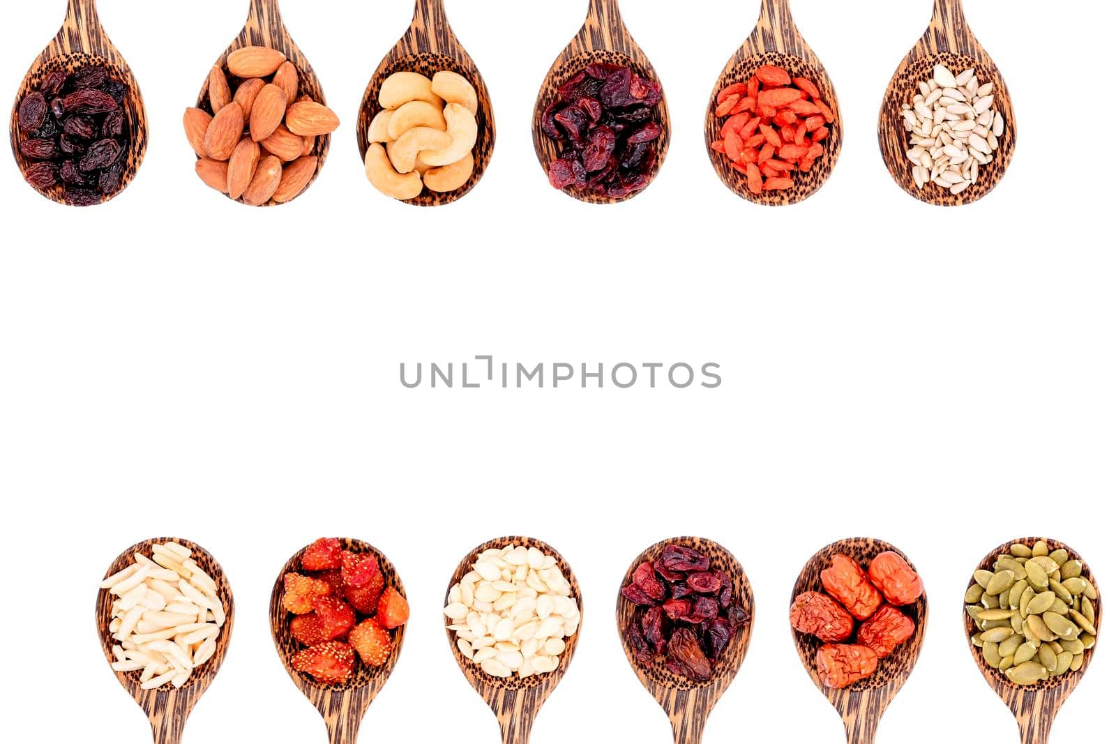 Top view group of whole grains and dried fruits 12 kinds on wooden spoons with copy space isolated on white background. by wattanaphob