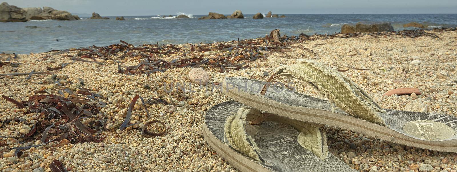 Flip flops on the beach, banner image with copy space