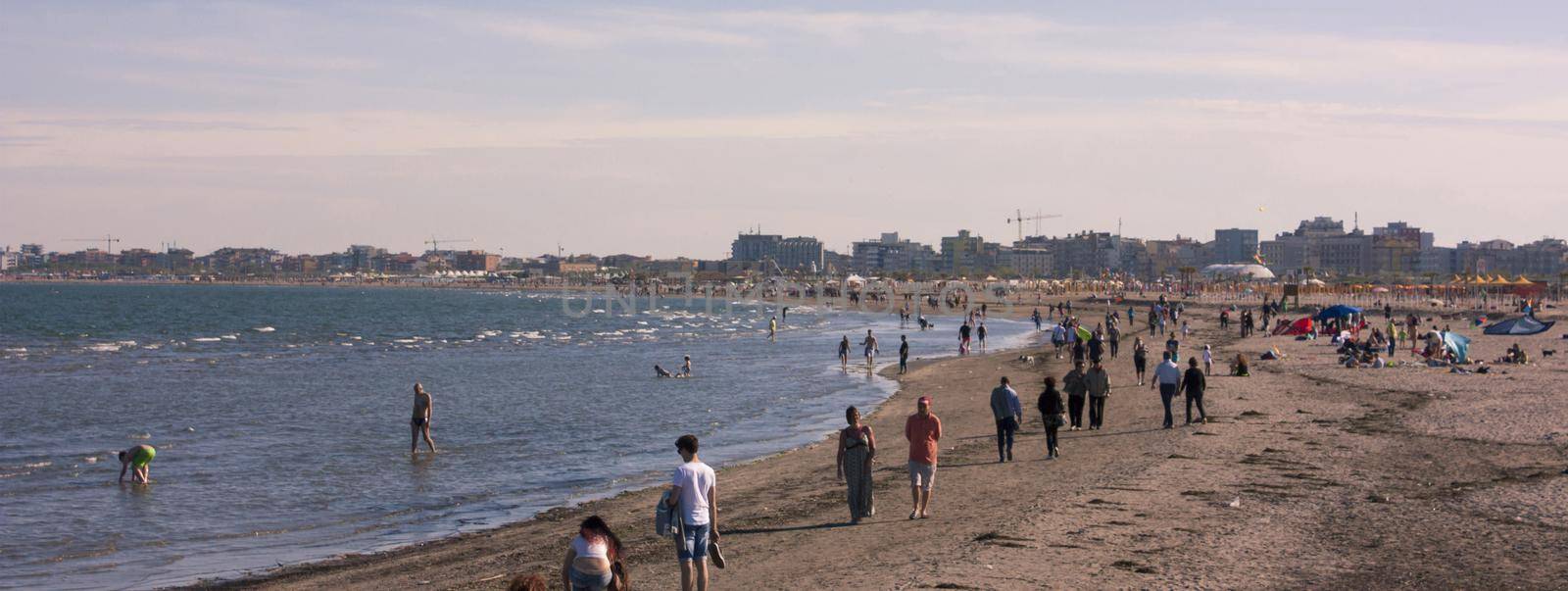 Beach with people, banner image with copy space