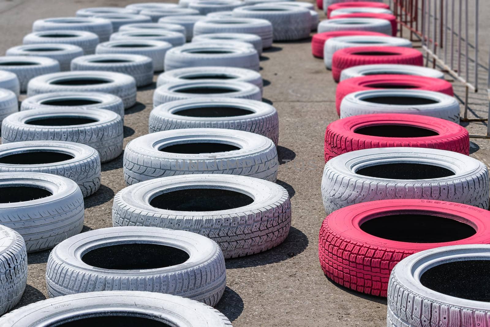 Tires lying on the track of the race track for safety in case of accidents