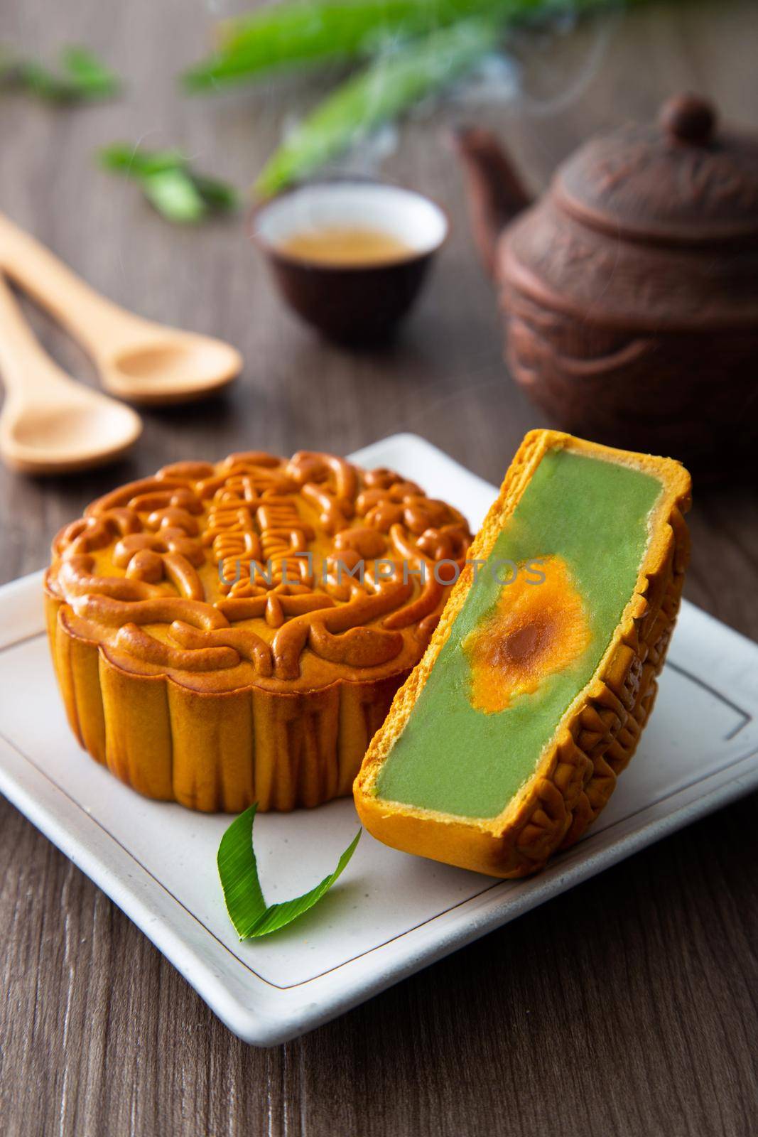 Moon cakes with Chinese tea. The Chinese character on the mooncake represent "Pandan lotus paste with single york" in English
