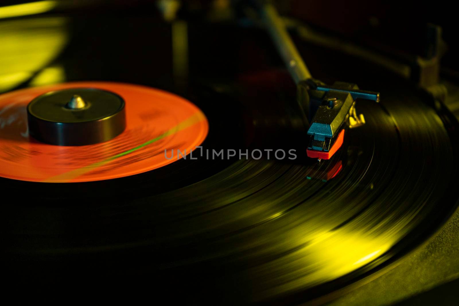 Turntable with vinyl record detail in low light picture