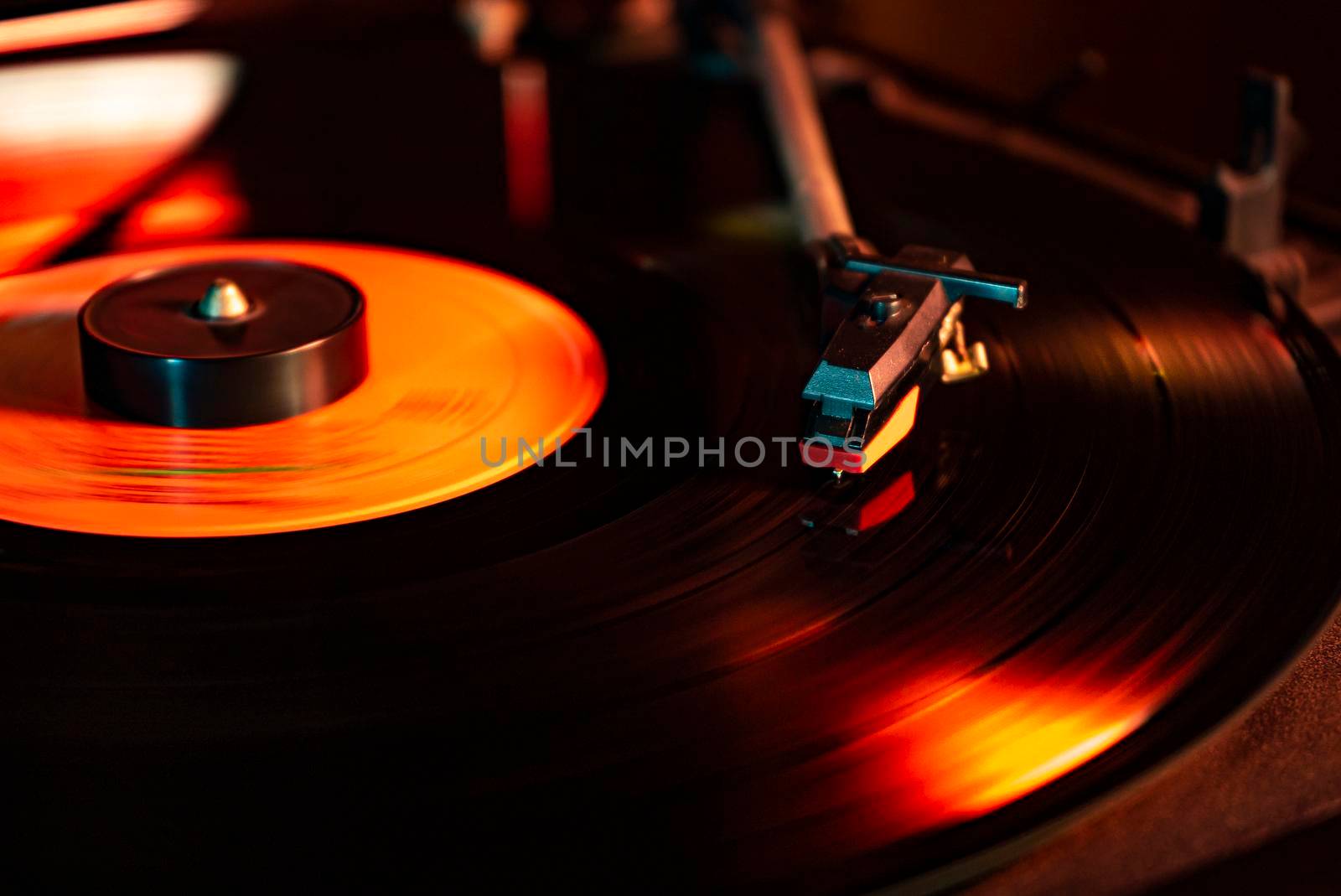 Turntable with vinyl record detail in low light picture