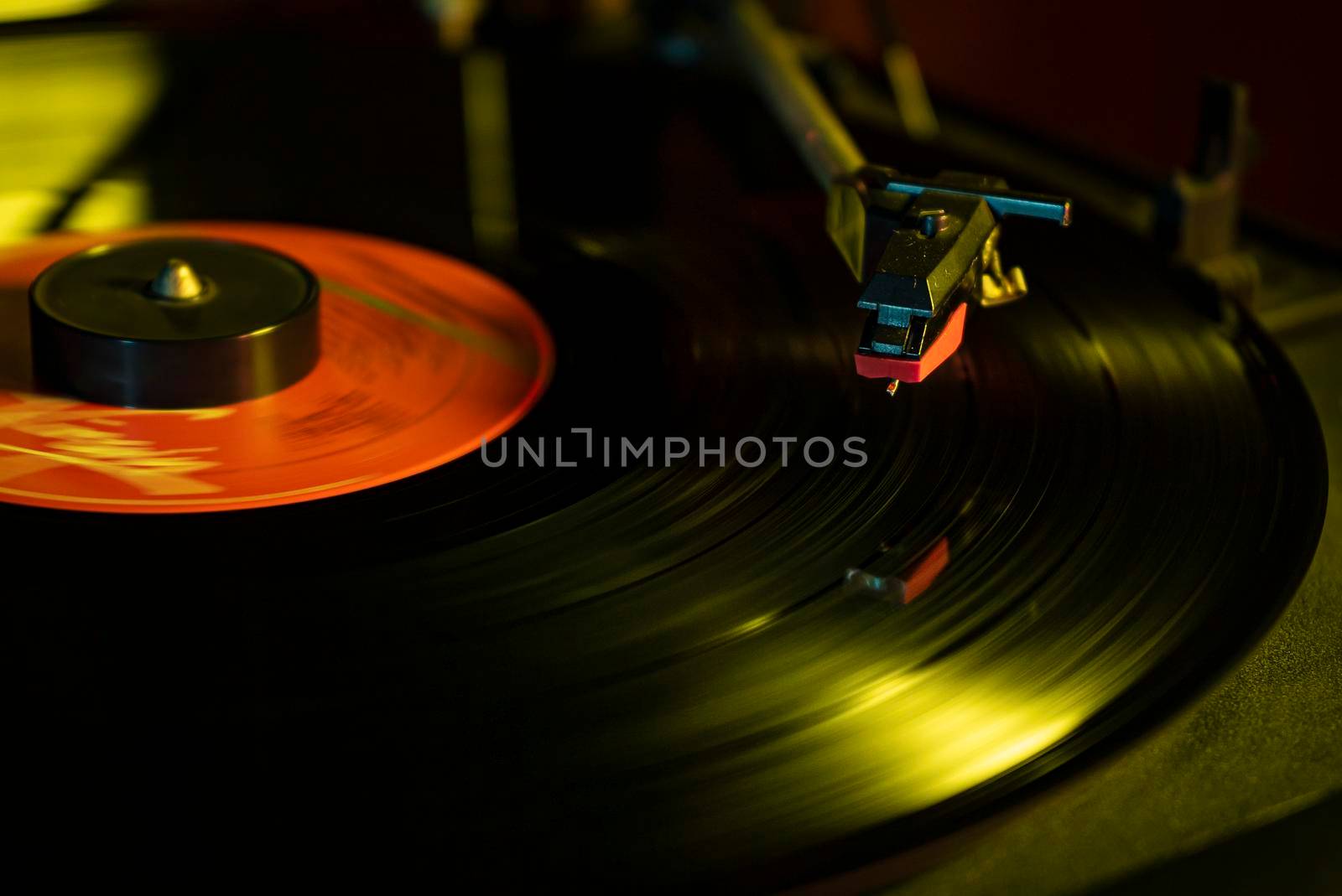 Turntable with vinyl record detail in low light picture