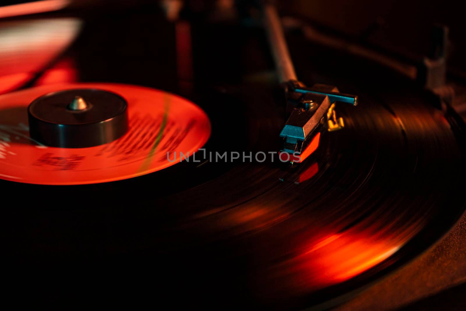 Turntable with vinyl record detail in low light picture