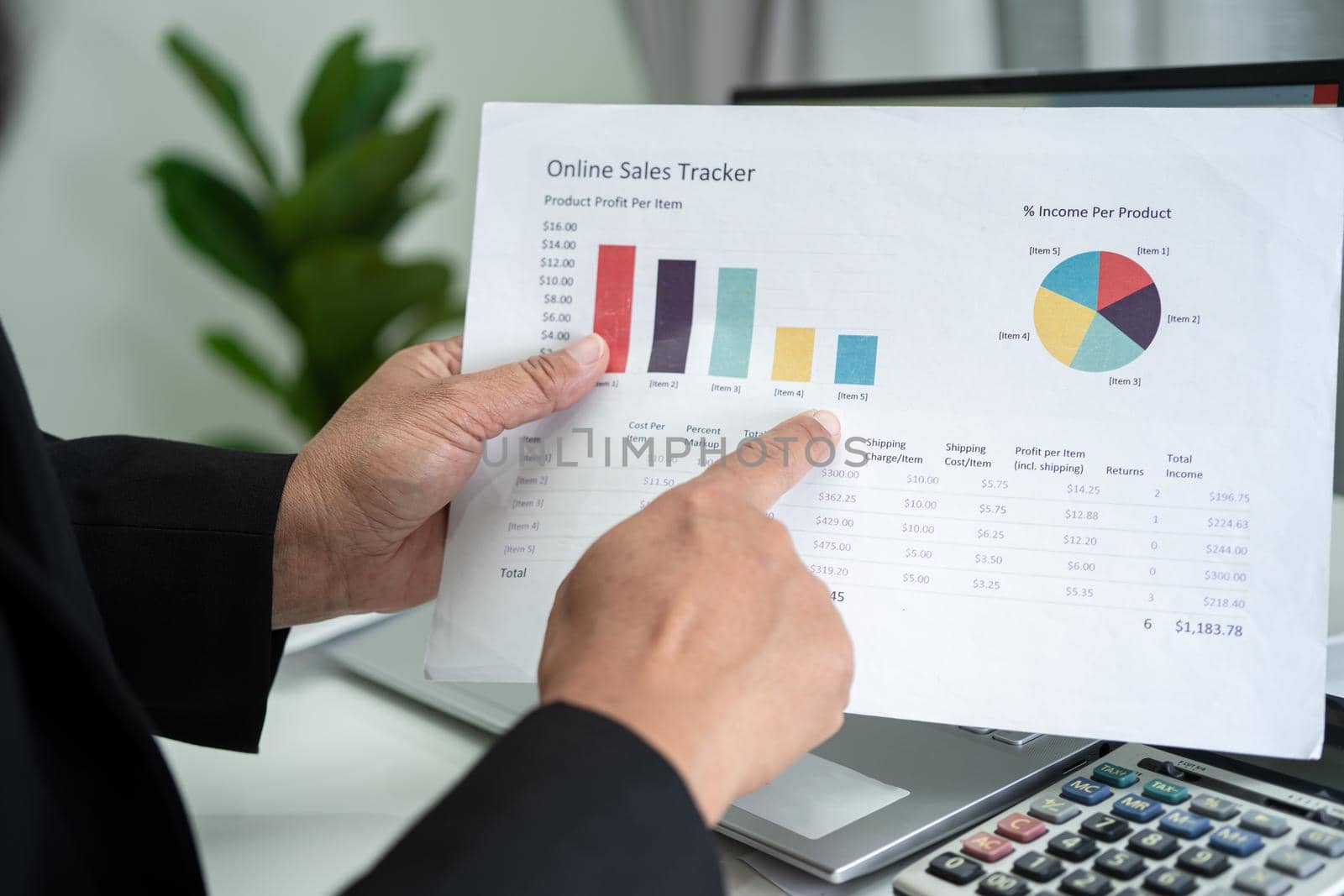 Asian accountant working and analyzing financial reports project accounting with chart graph in modern office, finance and business concept. by pamai