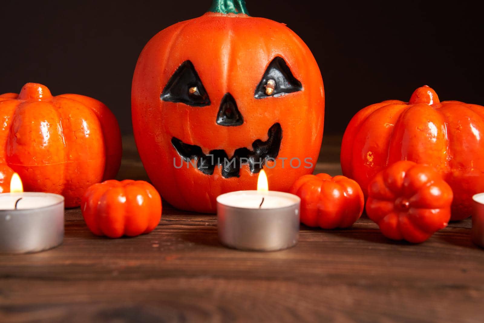 Halloween background, orange decorative plastic pumpkin black paper Thanksgiving greeting card pattern