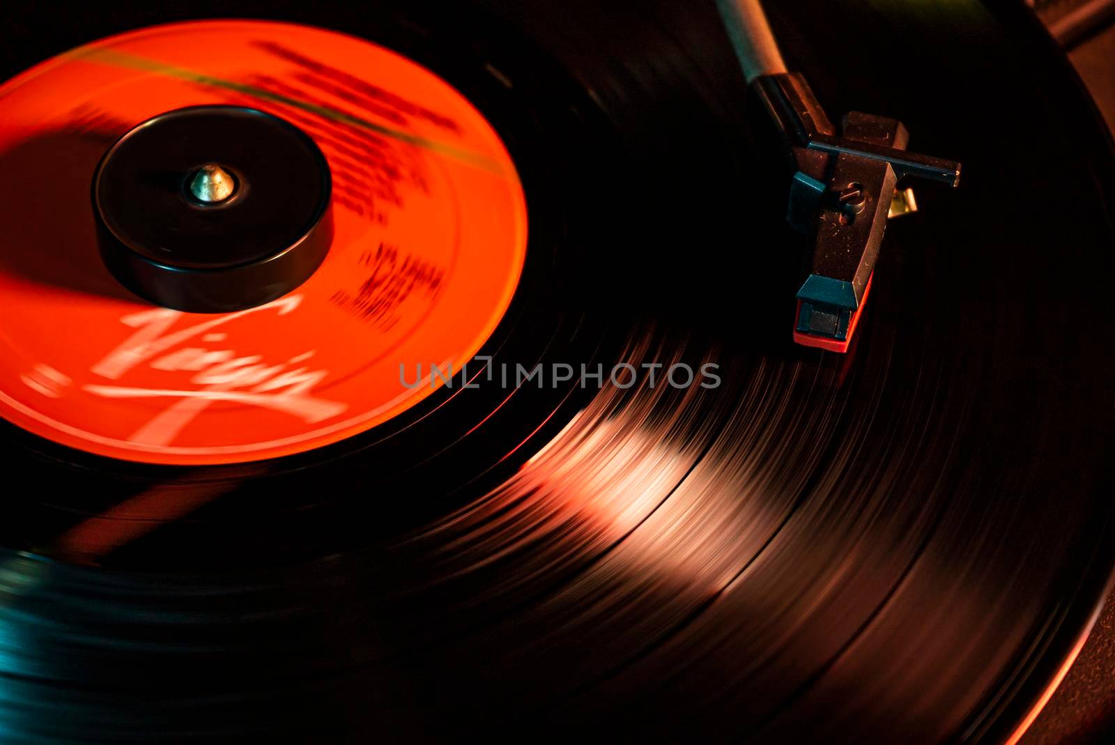 Turntable with vinyl record detail in low light picture