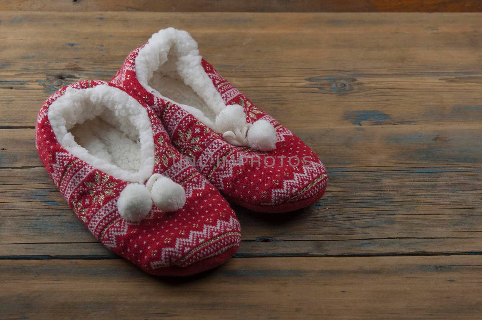Slippers on the wood floor. Soft comfortable home slippers