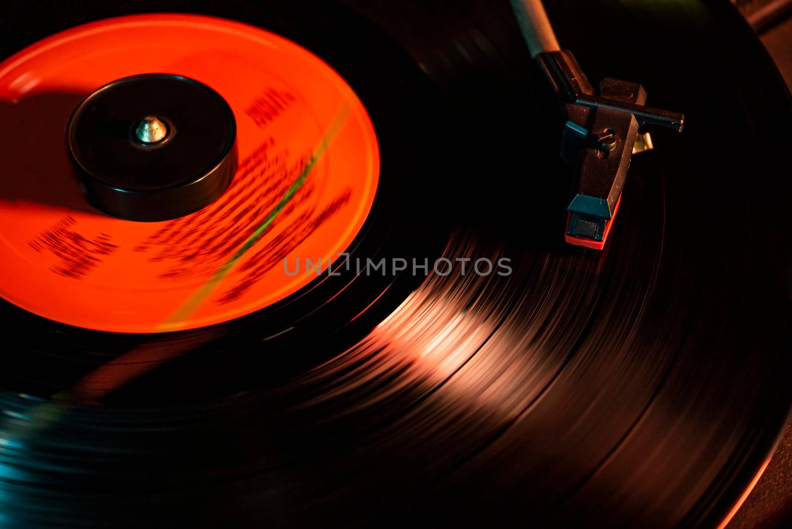 Turntable with vinyl record detail in low light picture