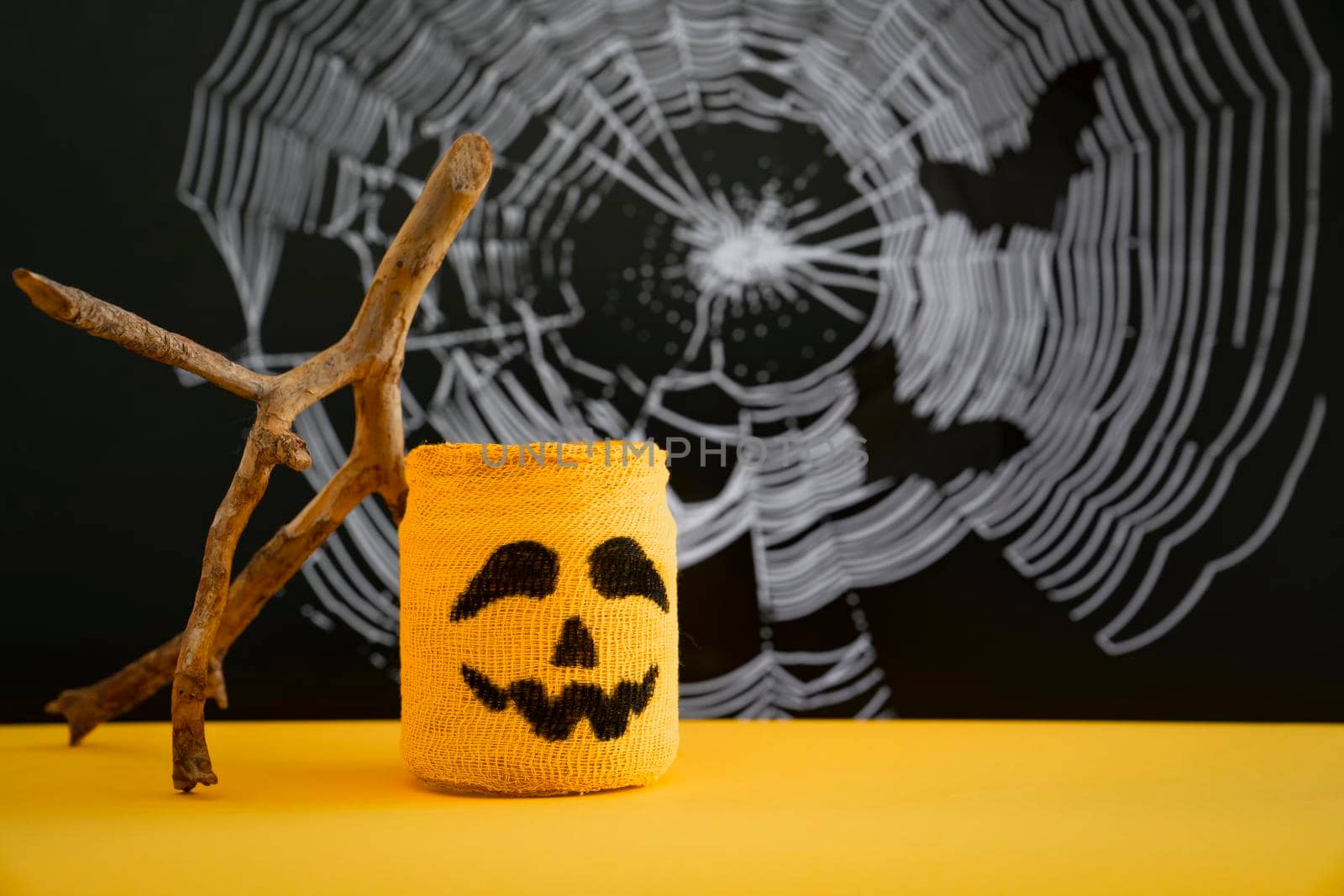 Halloween symbol against background of cobwebs and bats. Concept of halloween .