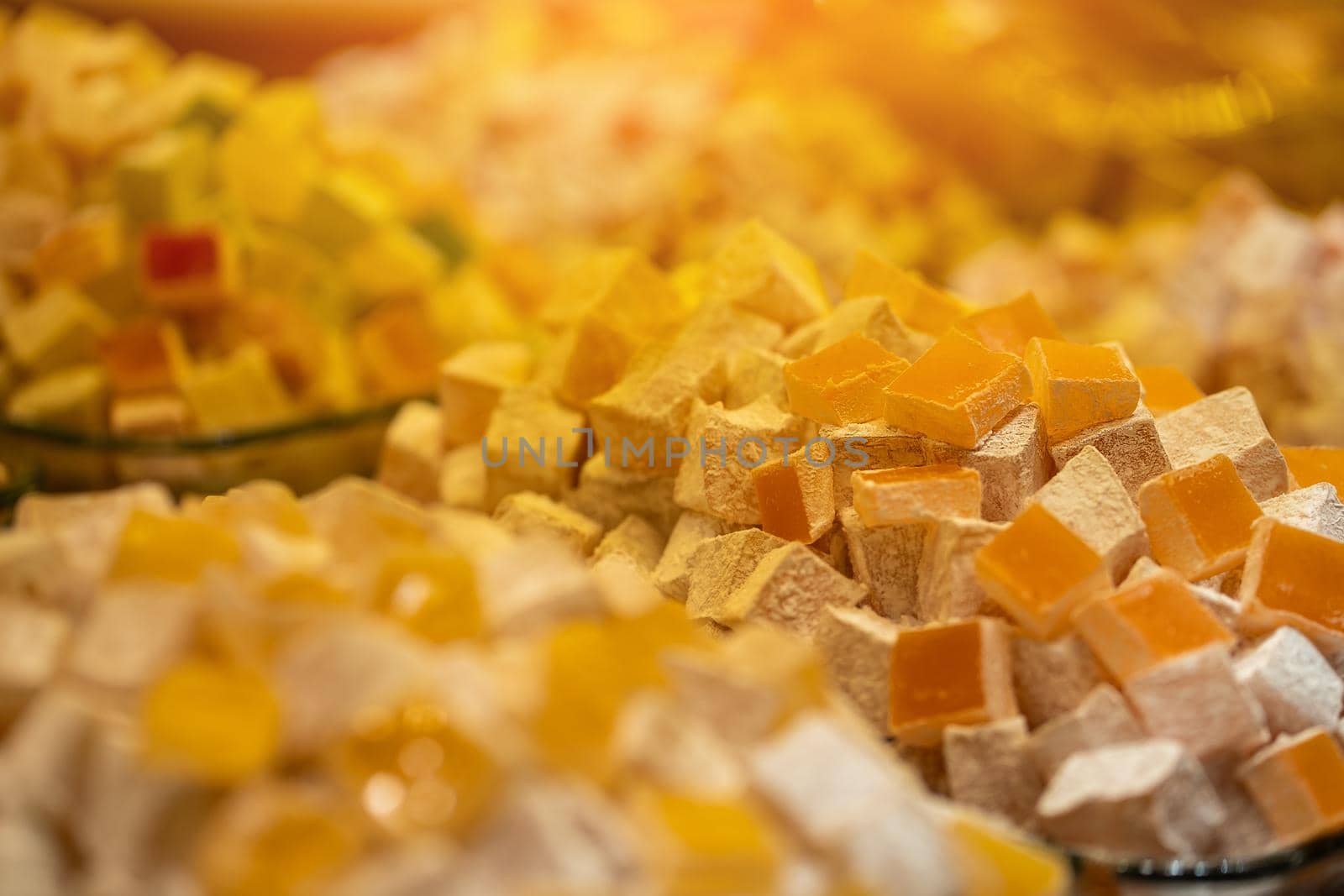 Eastern traditional sweets, a huge variety of types of Turkish delight: lokum with pistachios, cocoa, saffron, nuts, roses and much more. Grand Bazaar in Istanbul, Turkey.