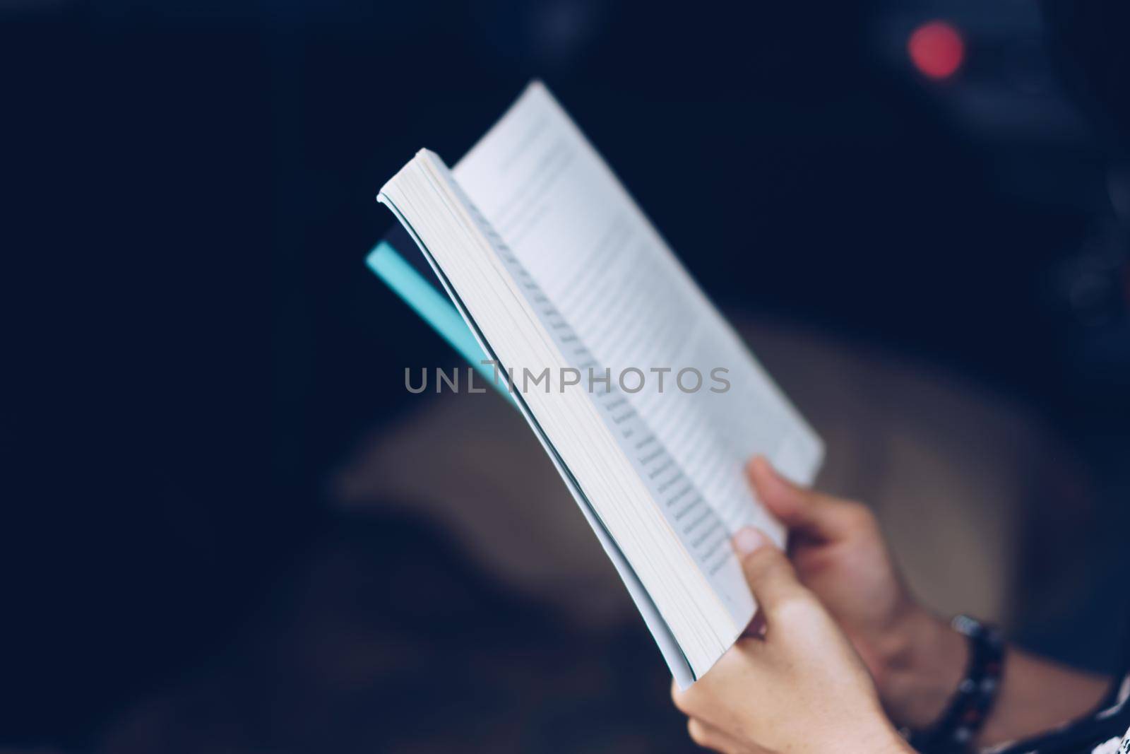 A person is reading book in car feel relax and peaceful environment background.
