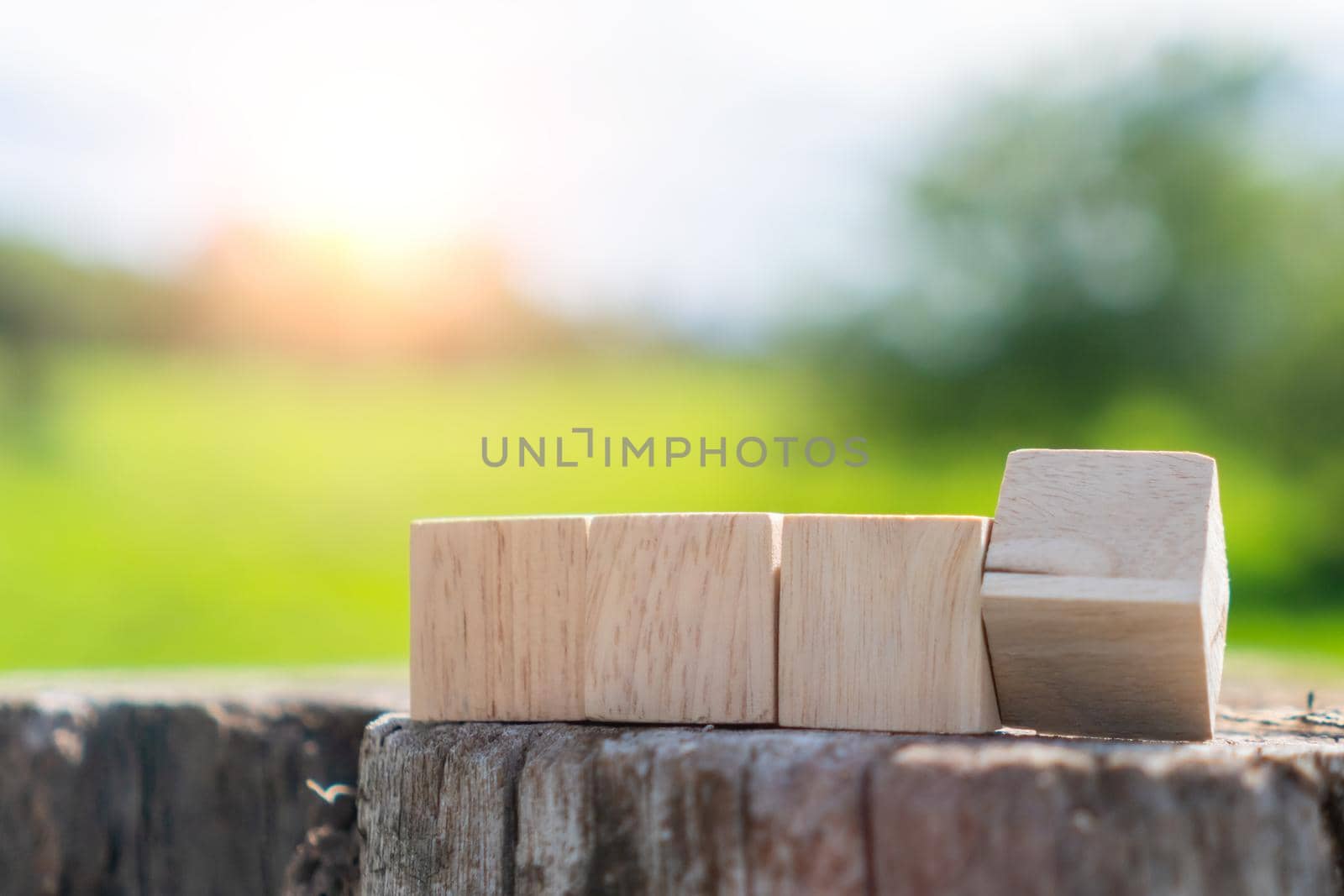 In a hand-held background, a blank wooden cube can be used to add text. by Suwant