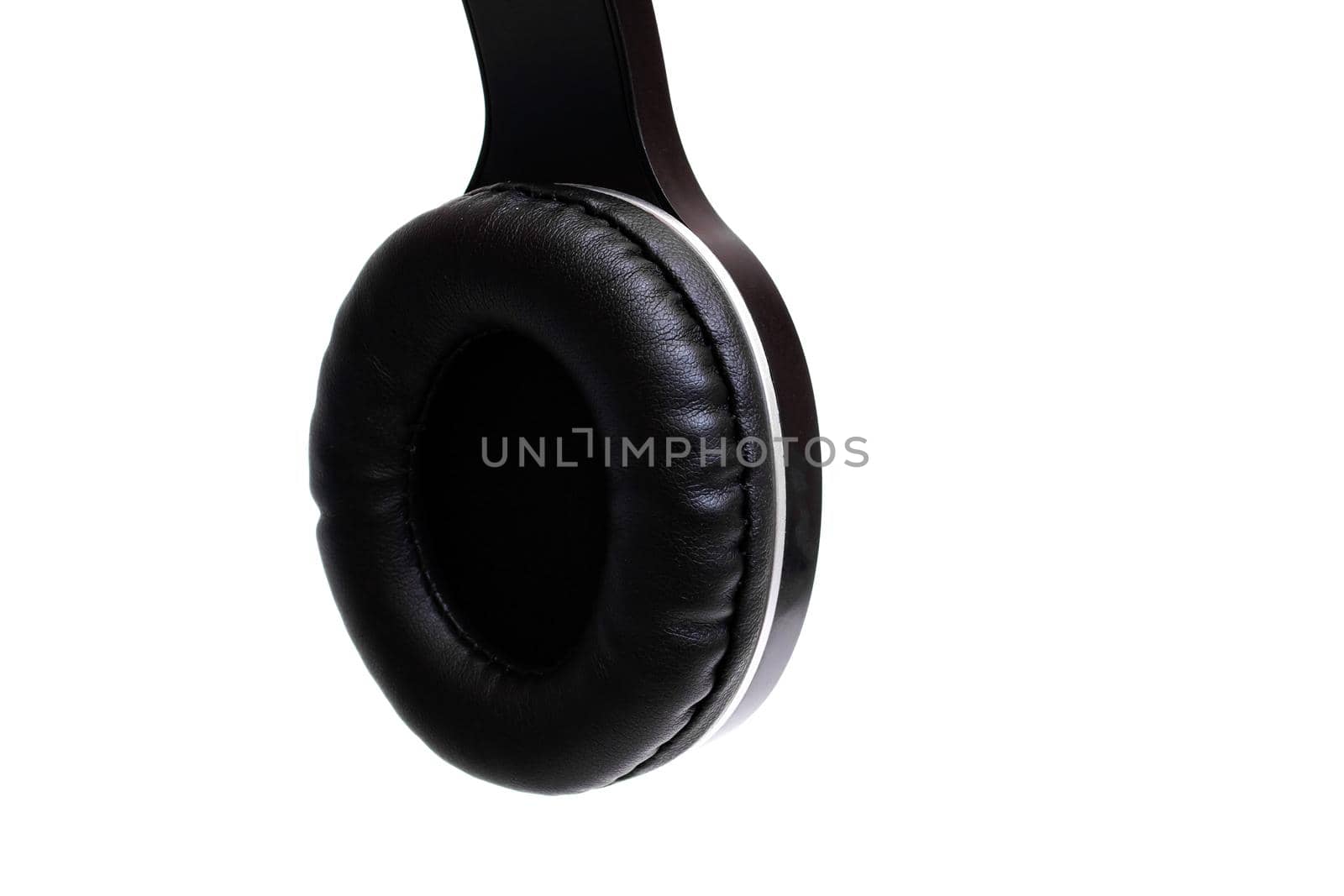 One piece of headphones isolated on a white background