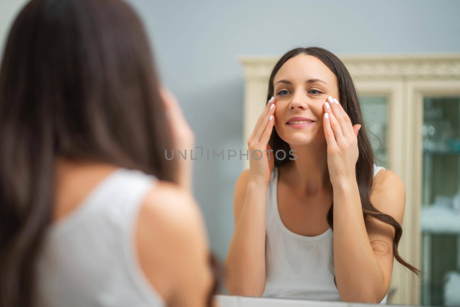 Beautiful woman enjoying her skin after successful skin treatment.