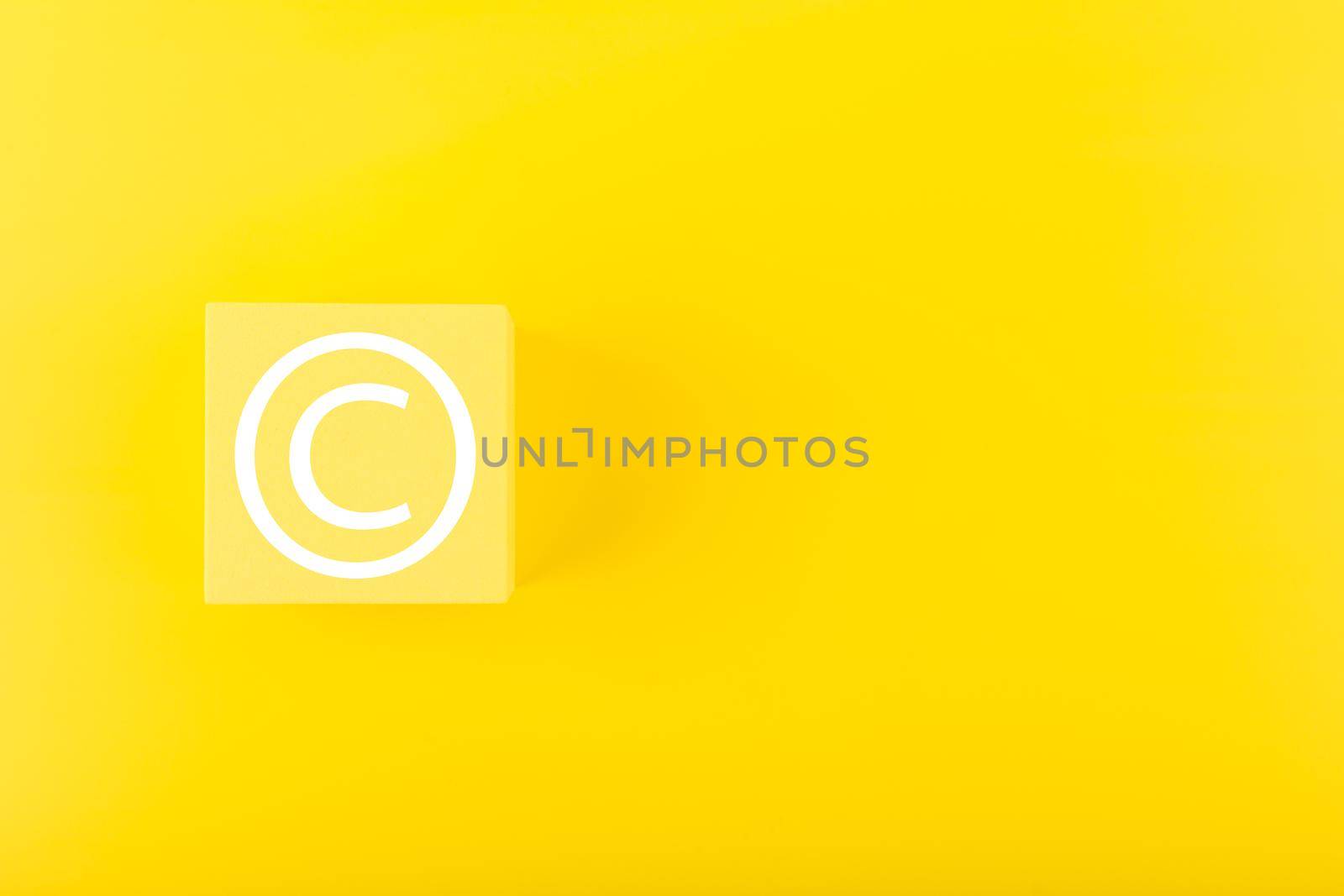 Minimal yellow copyright protection concept on yellow background with copy space by Senorina_Irina