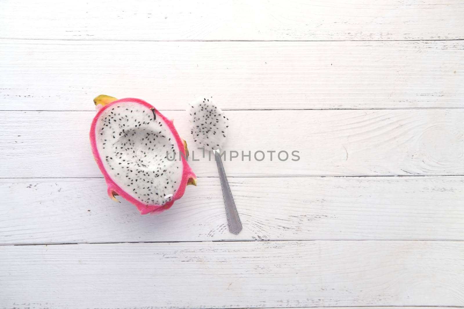 slice of dragon fruit and spoon on white background ,