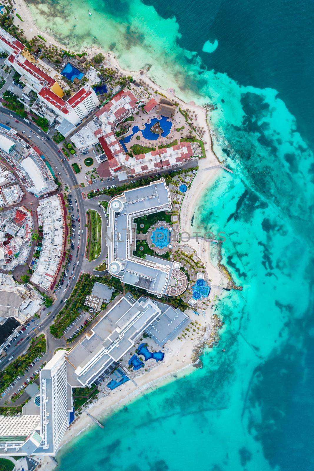 Aerial top view of Cancun city hotel zone in Mexico. Caribbean coast landscape of Mexican resort with beach Playa Caracol and Kukulcan road. Riviera Maya in Quintana roo region on Yucatan Peninsula