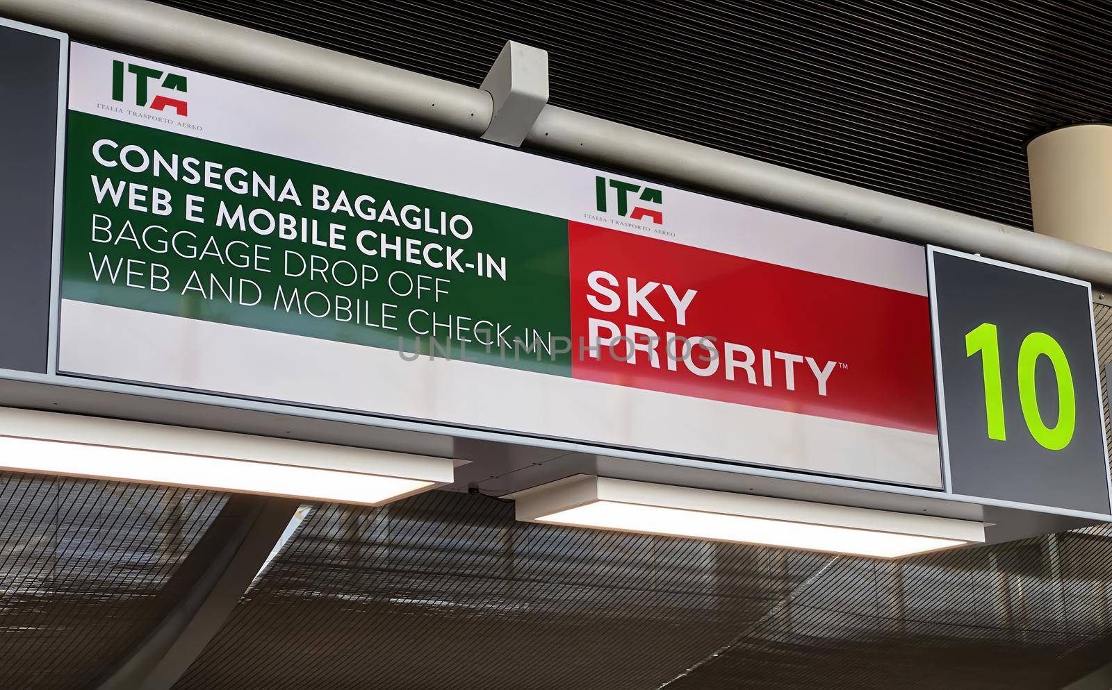 Catania, Italy, August 2021: Information panel of the ITA desk inside the Catania airport. Luggage drop off and check in. ITA is the new Italian flag carrier starting from 15 October 2021
