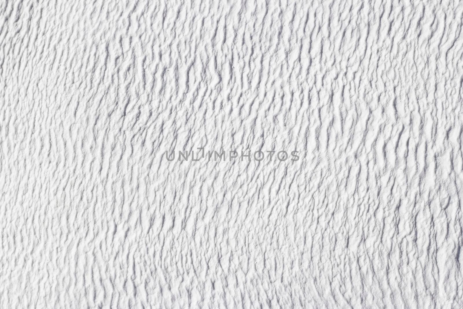 Gray texture of abstract background of Pamukkale calcium travertine in Turkey.